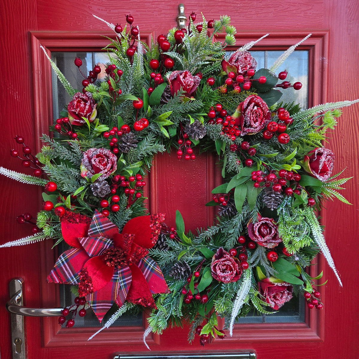 70cm artificial Christmas wreath with burgundy roses, red berries and tartan poinsettia