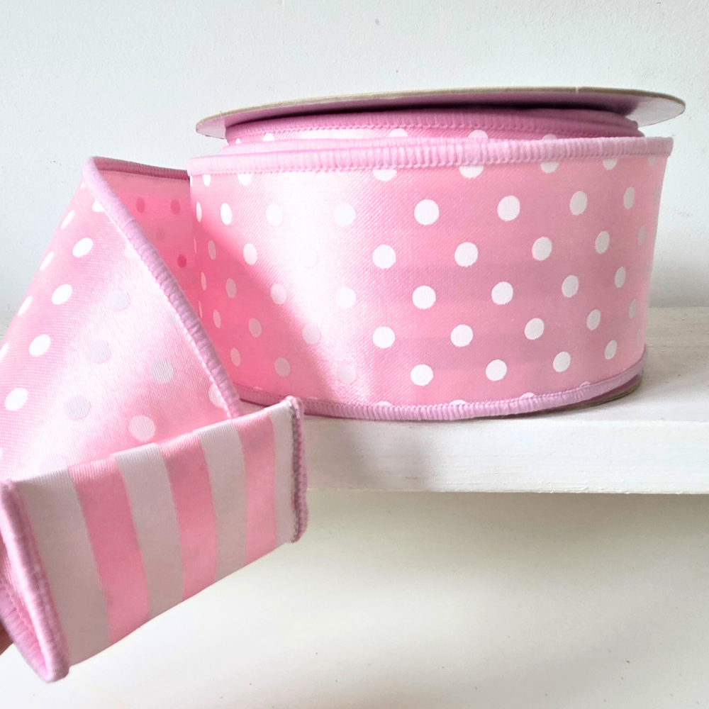 2.5" Wired ribbon. Fused backing with pattern on one side in polka dot, pattern on reverse is strip n pink and white.  Sold by the meter.