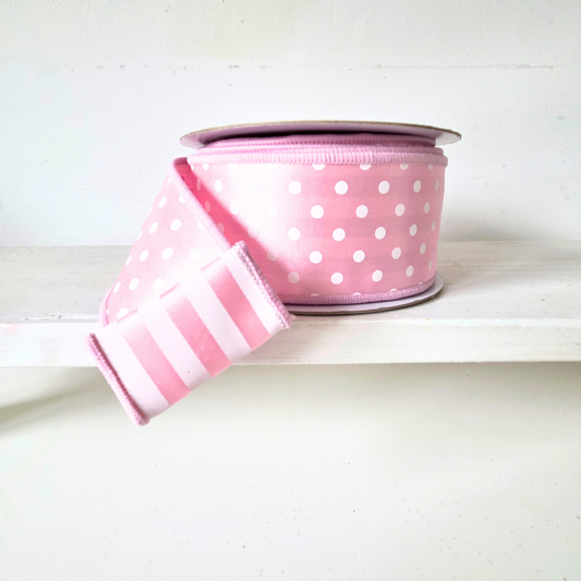 2.5" Wired ribbon. Fused backing with pattern on one side in polka dot, pattern on reverse is strip n pink and white.  Sold by the meter.
