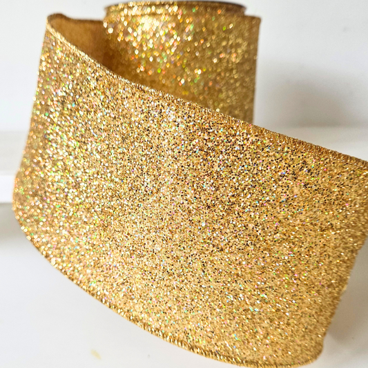 High quality USA imported wired ribbon. A super chunky 4 inch ribbon in Gold Laser Glitte ribbon.  Sold by the meter.