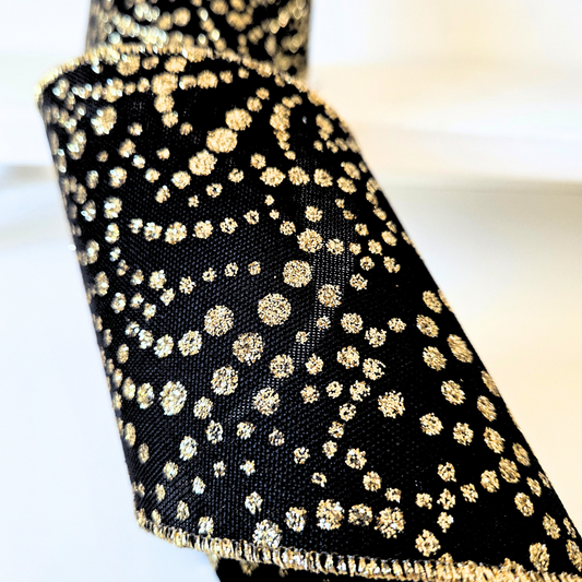 USA imported wired ribbon.  4"Mini Glitter Dots Black/Gold tiny glitter dots in a striking black and gold color scheme.  Sold by the meter.
