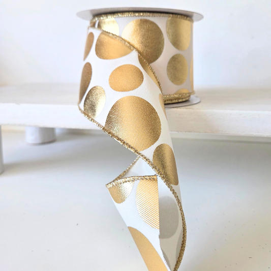 USA imported wired edge ribbon. 2.5" wide, in ivory with metallic gold dots. Sold by the meter.