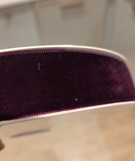 Velvet ribbon (non wired) in traditional Christmas colours (available in red, deep burgundy and deep green). 25mm wide. Sold by the meter